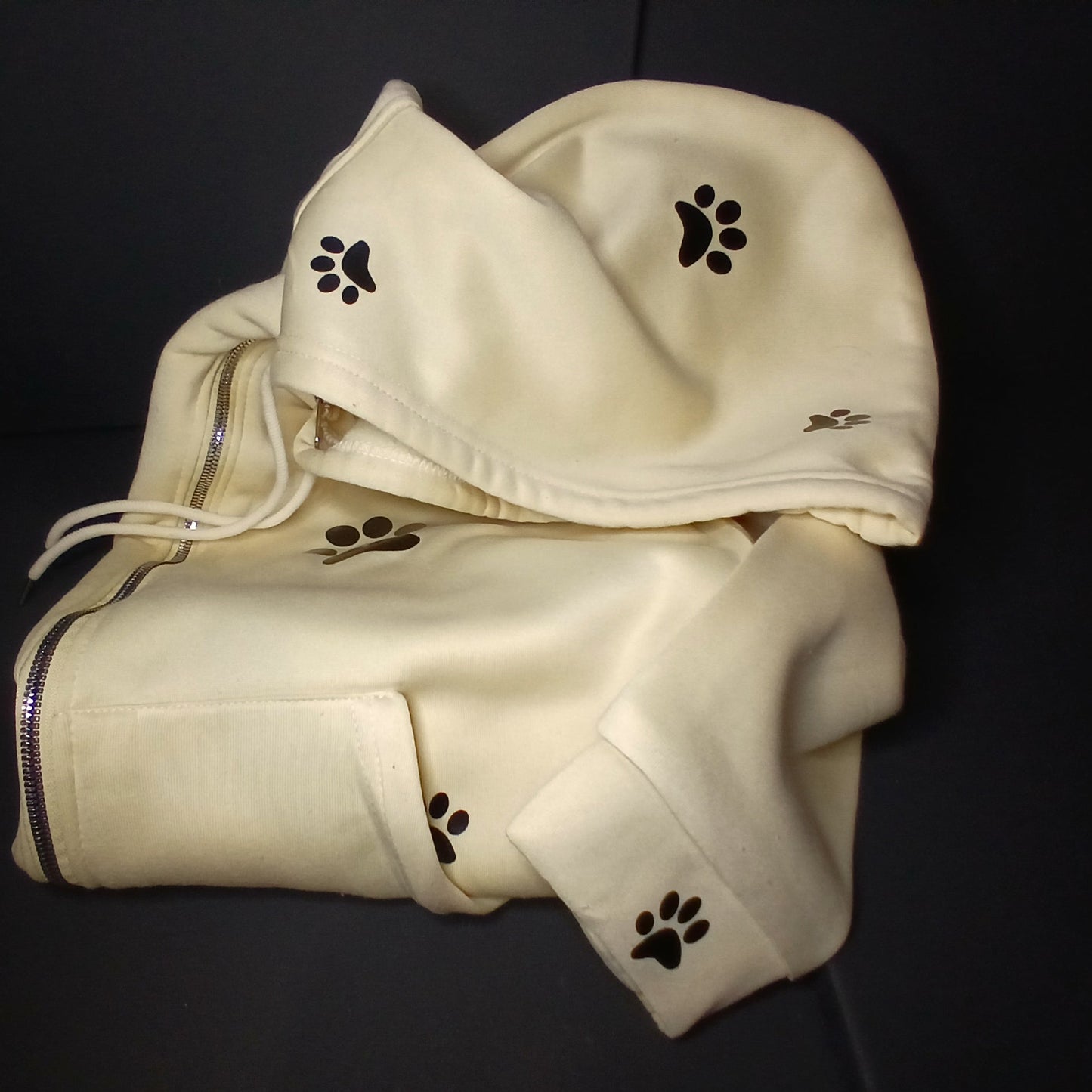Light yellow hoodie with paw prints 