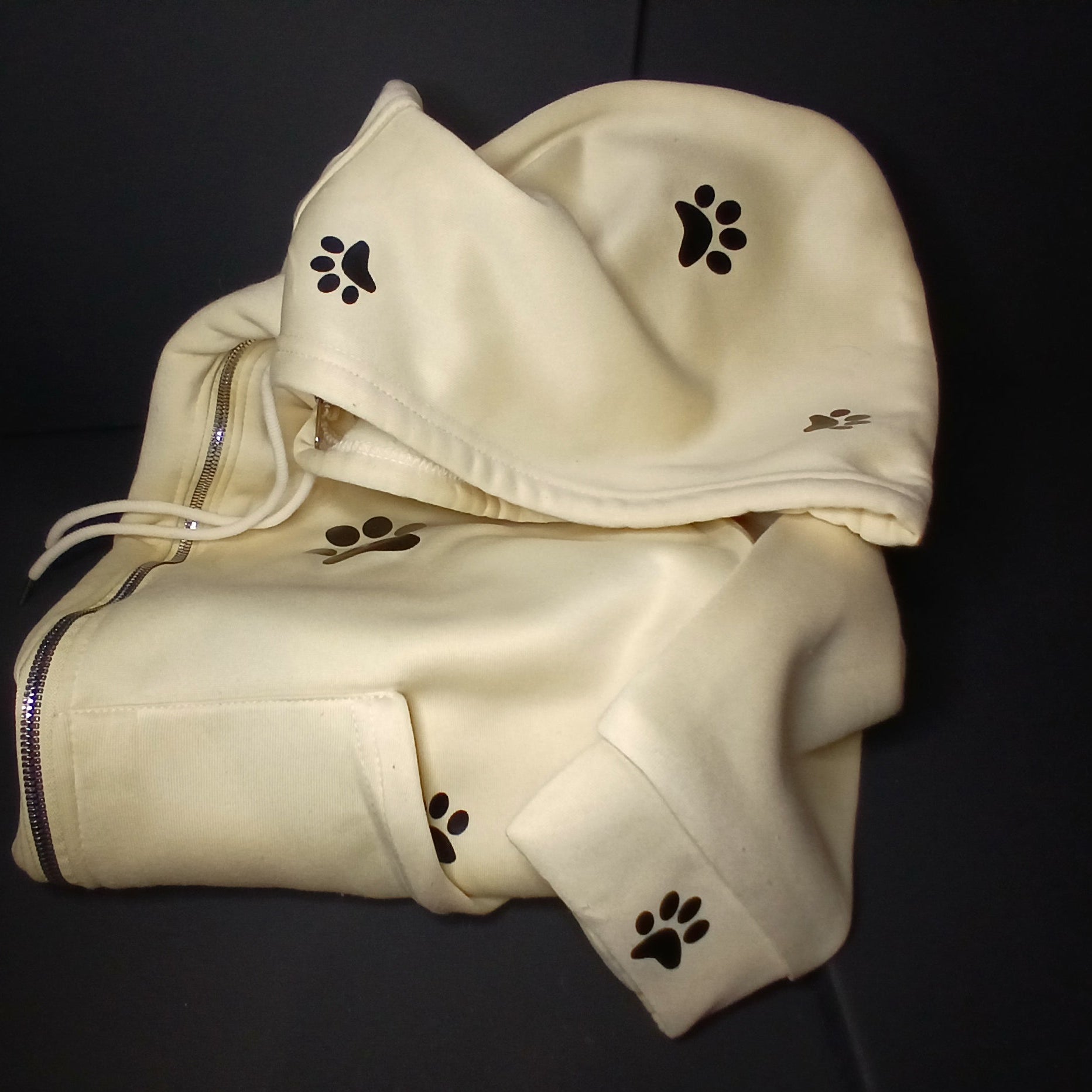 Light yellow hoodie with paw prints 
